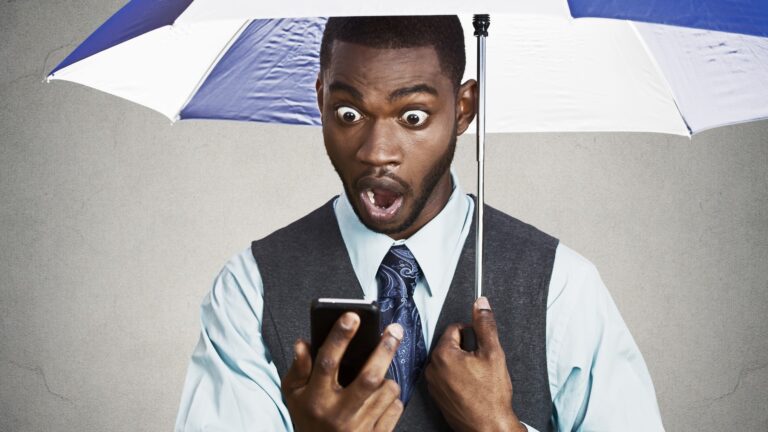 shocked-staring-at-phone-dreamstime_m_47997709-2